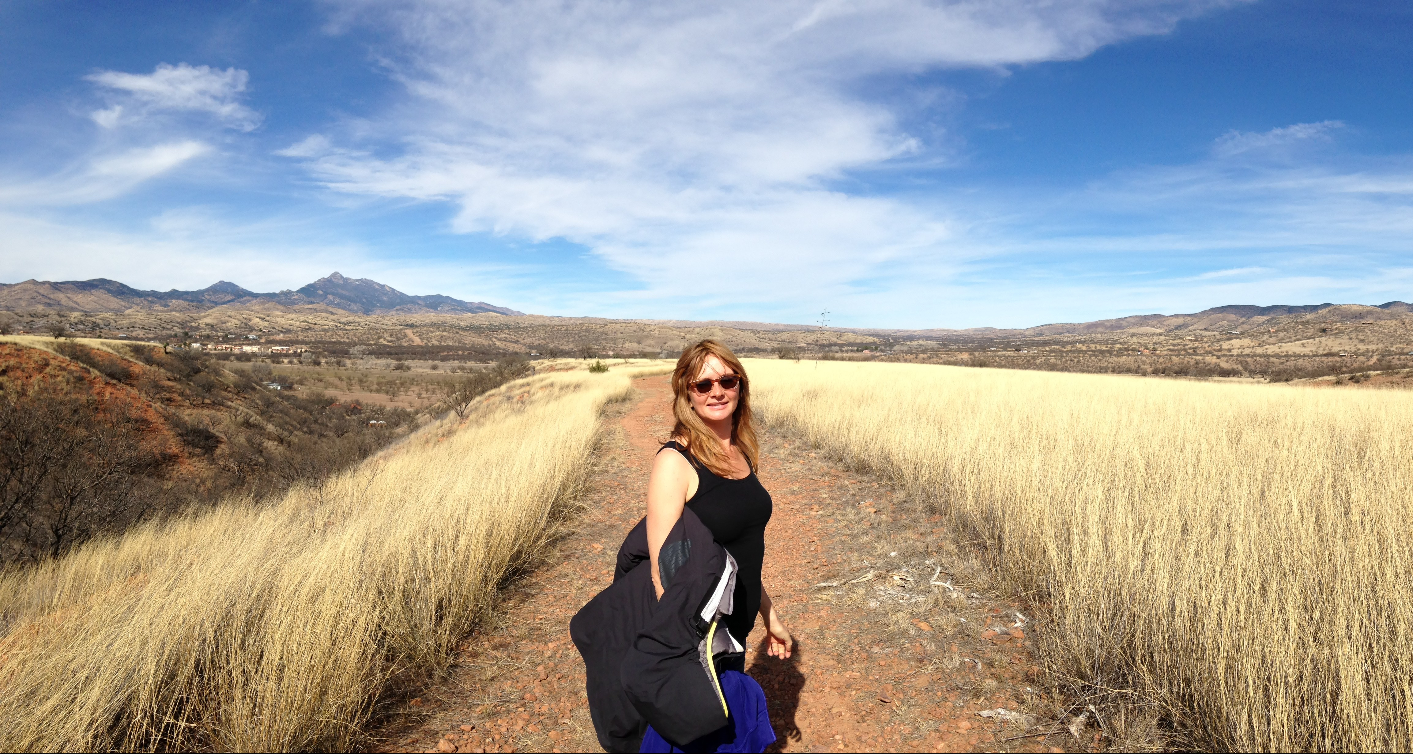 Blonde woman in plateau among mountains