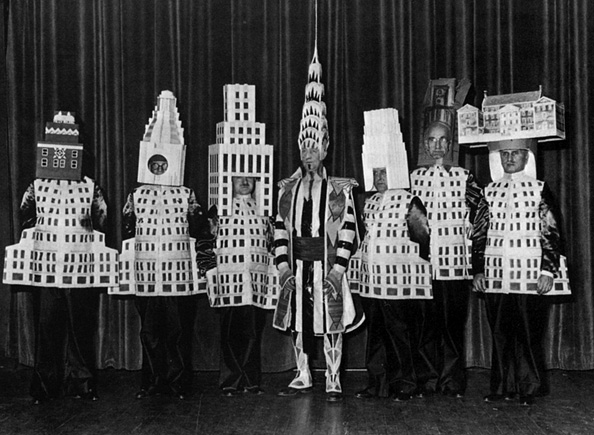 People wearing building costumes