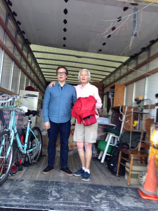 Man and woman standing in moving truck