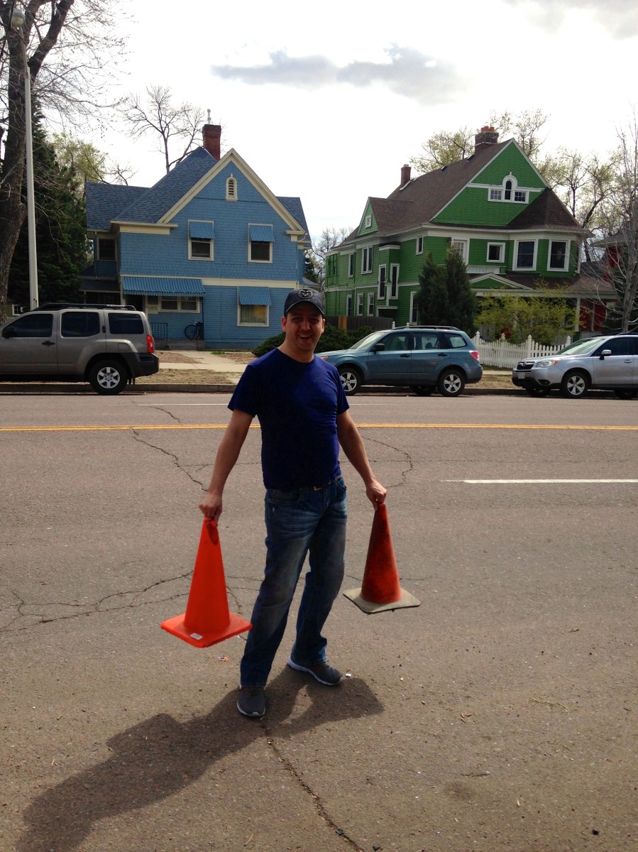 Man with orange traffic cones